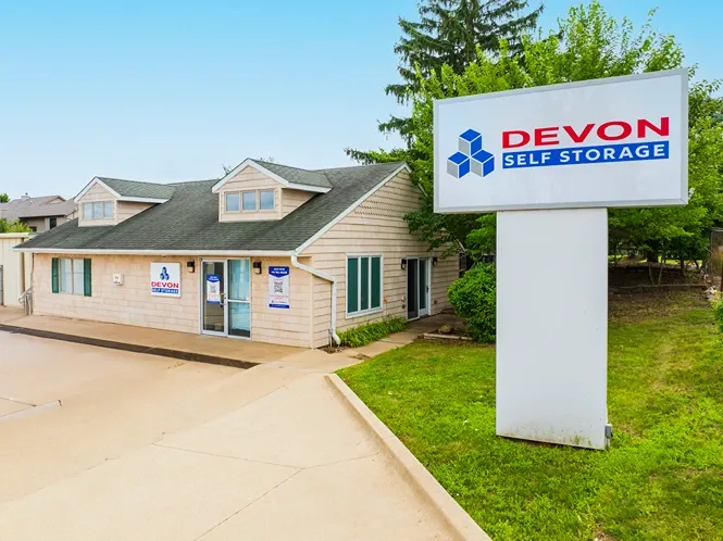 Self storage office building with Devon Self Storage signage and customer parking